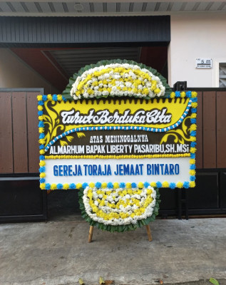 Papan Bunga Duka di Assue